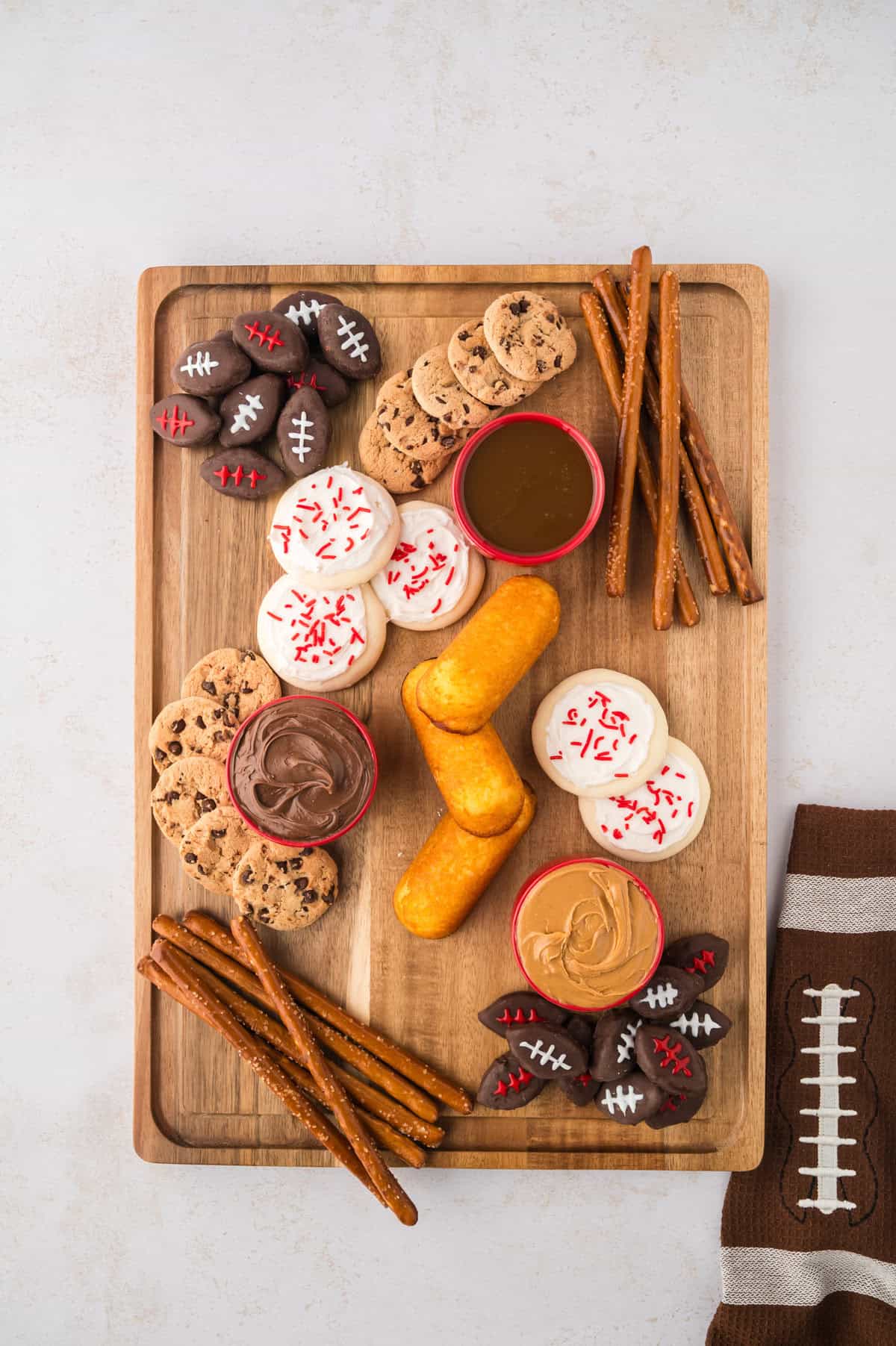 Snack board filling up with treats.