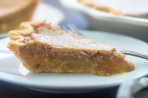 Piece of pie on a white plate.