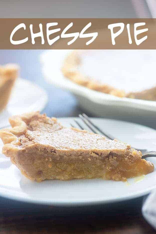 A triangle-shaped piece of pie on a white plate.