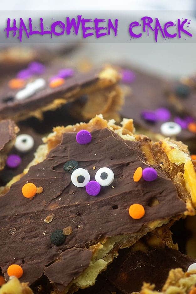 Toffee topped with melted chocolate with a candy face on it.