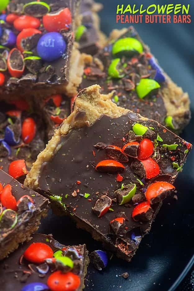 Peanut butter bar squares topped with chocolate and crushed M&M\'s.