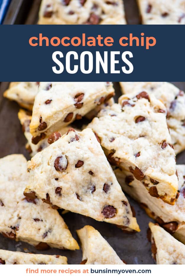 Chocolate chip scones piled on baking sheet.