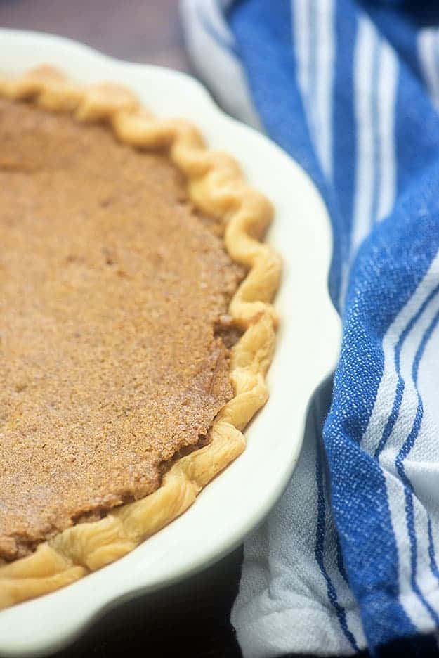 A full pie in a white pie plate.