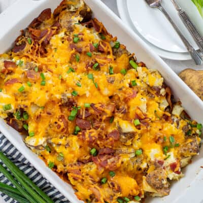 overhead view of loaded potato casserole in white baking dish.