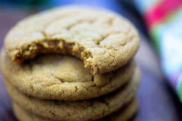 Stack of gingerbread cookies and the top one has a bite out of it.