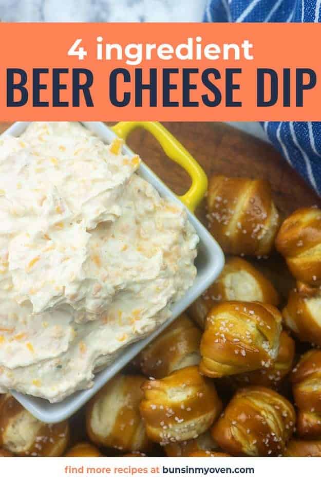A bunch of pretzel bites next to a pan of cheese dip.