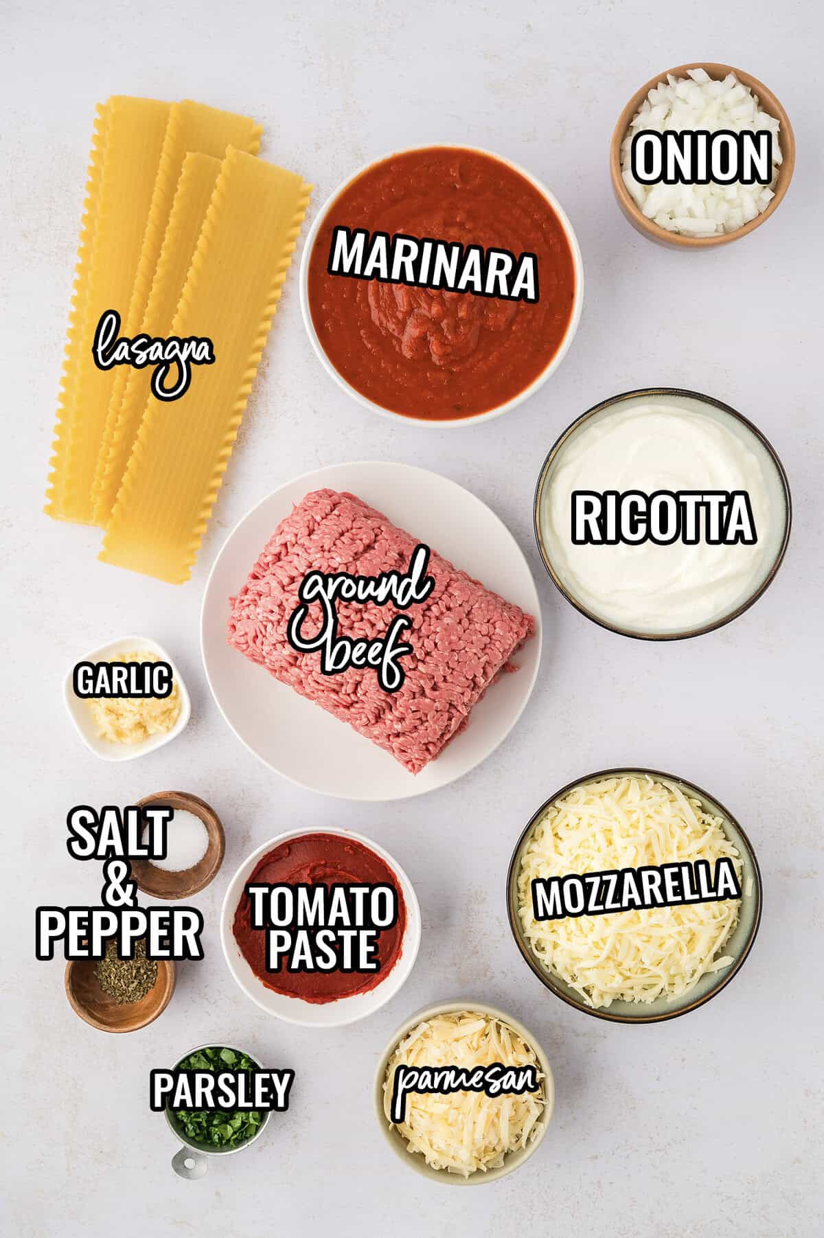 Ingredients for crockpot lasagna recipe laid out on counter.