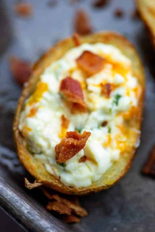 Potato skins with cream cheese and bacon.