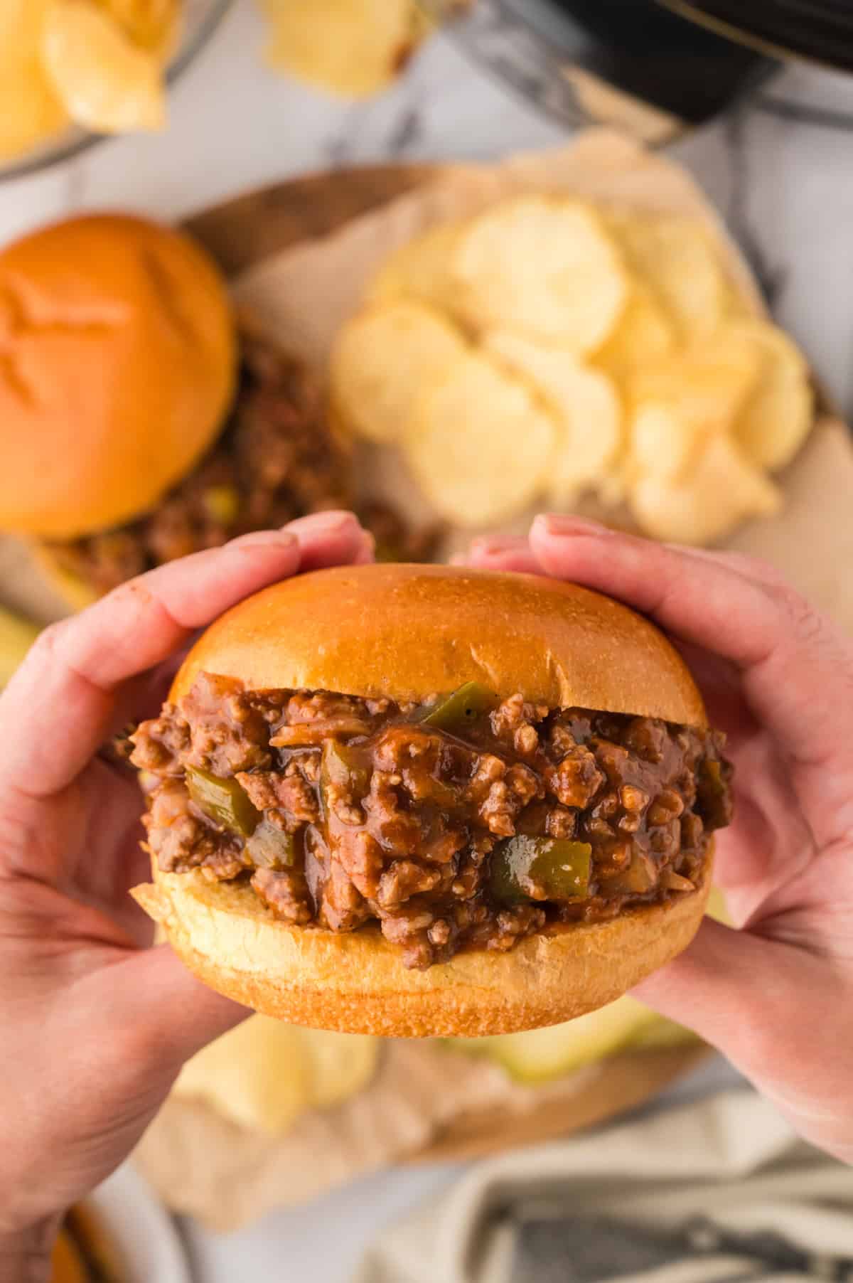 Sloppy Joe filling on a wooden spoon.