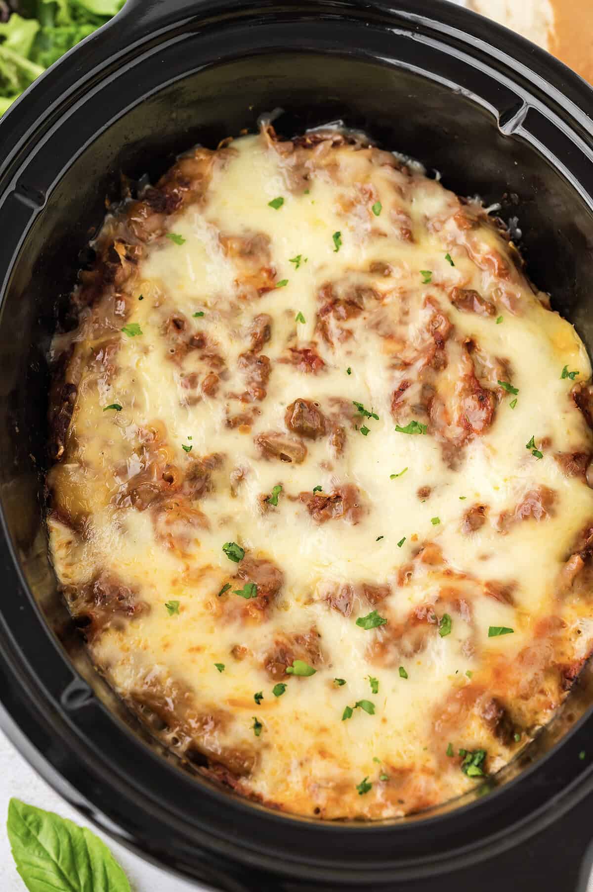Cooked lasagna in slow cooker.
