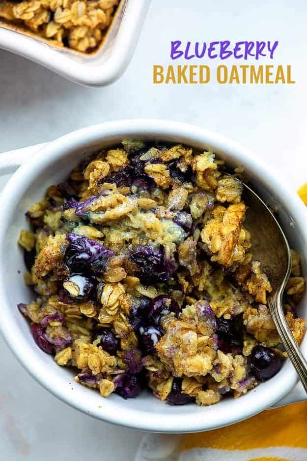 Small white bowl with oatmeal and blueberries.