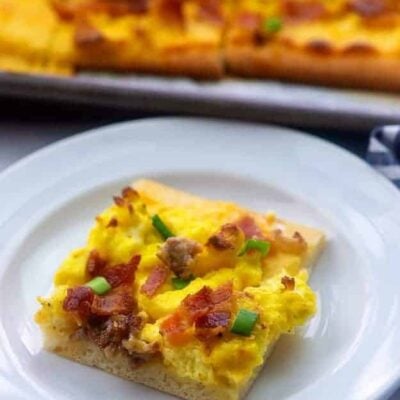 sausage breakfast pizza recipe on white plate