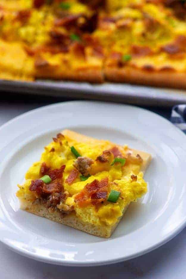 sausage breakfast pizza recipe on white plate