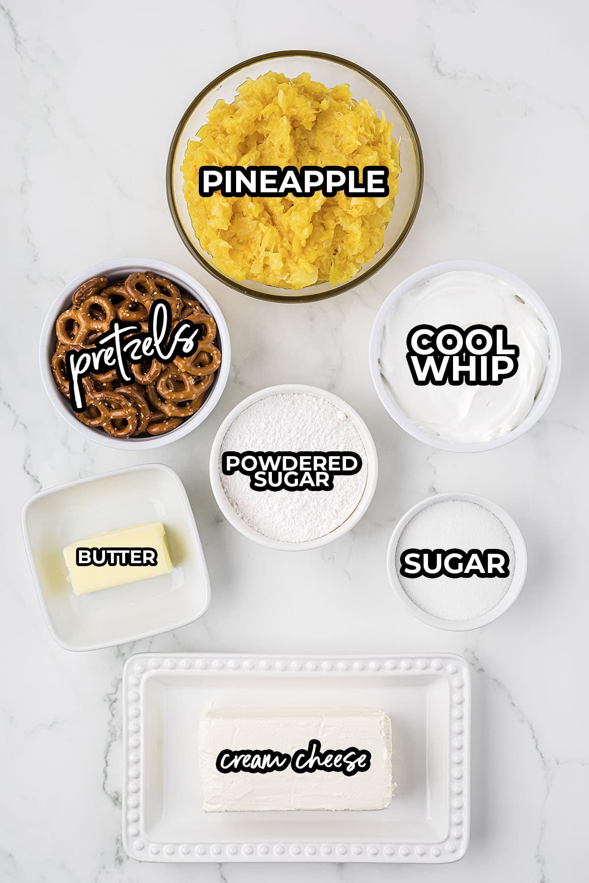 Ingredients for pineapple pretzel salad on counter.