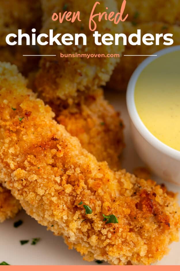 Chicken strips next to dipping sauce.