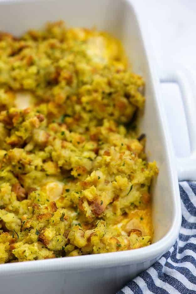 baked casserole with chicken, broccoli, and stuffing in white baking dish
