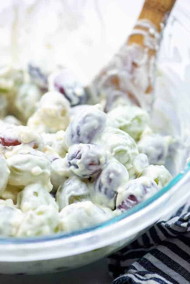 grape salad with cream cheese in glass bowl