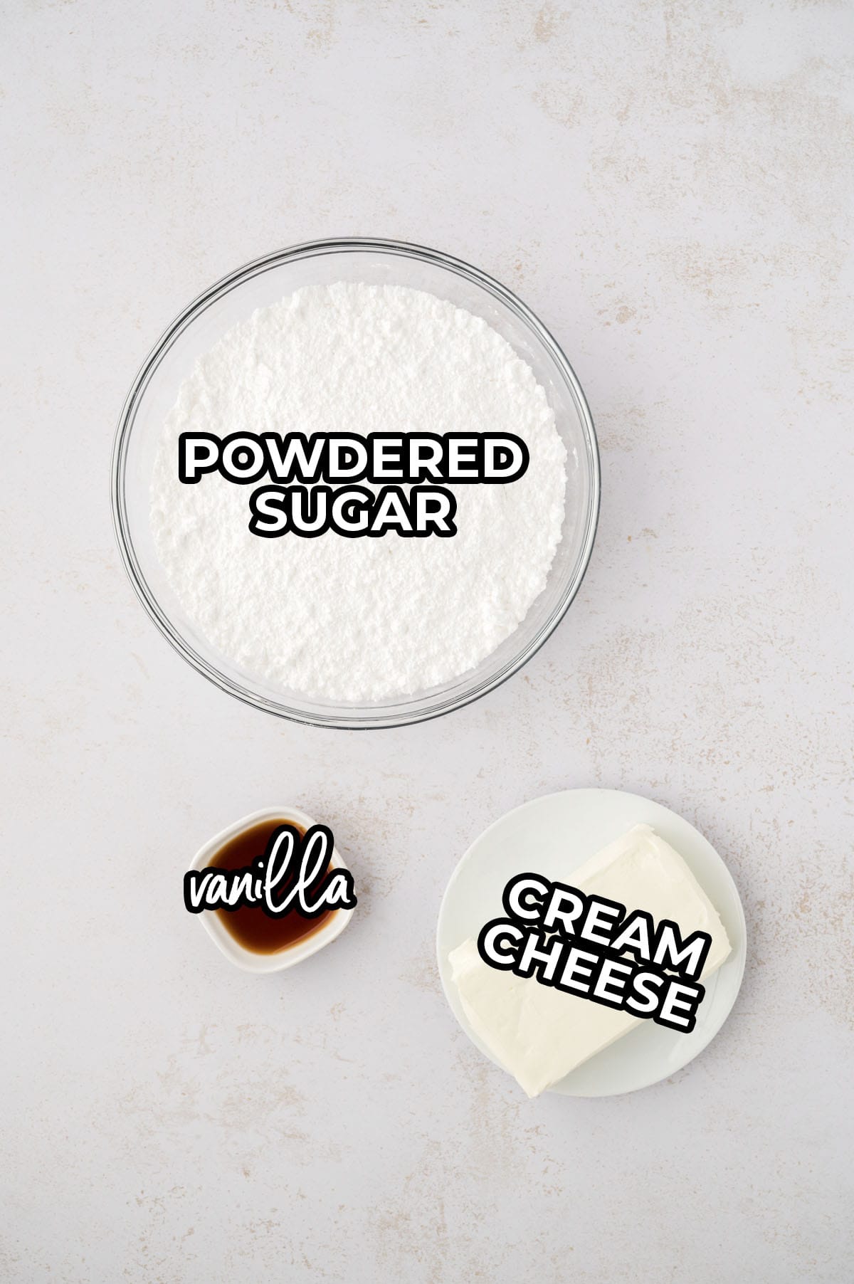 3 ingredient cream cheese frosting recipe ingredients on counter.