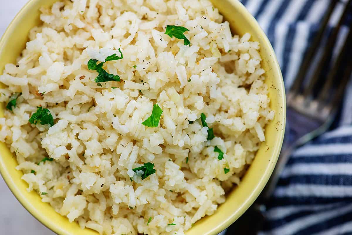 yellow dish full of rice pilaf.