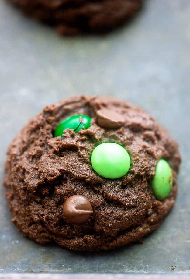 Chocolate cookies with green m&m\'s.