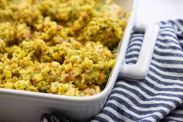 stove top stuffing in white casserole dish over chicken and broccoli