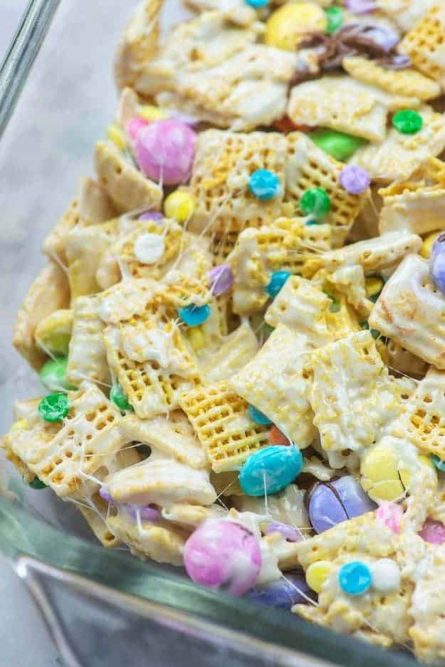 cereal bars with candy and sprinkles in glass baking dish