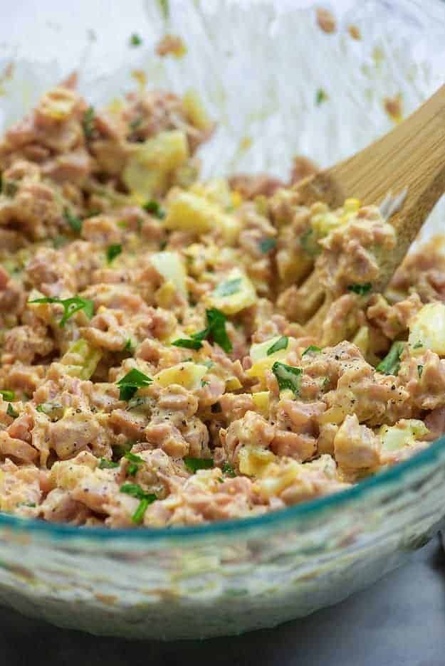 dill pickle ham salad in glass mixing bowl
