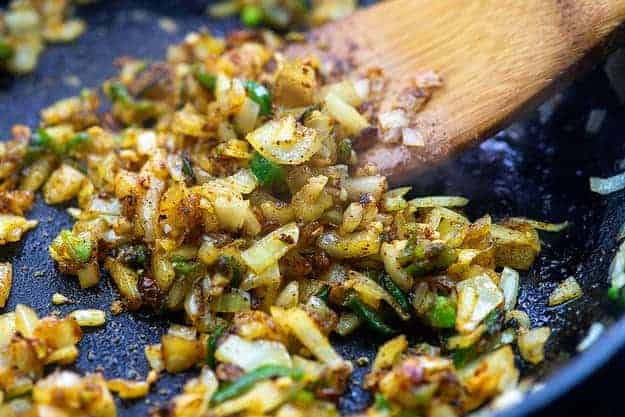 onions and jalapenos in cast iron skillet