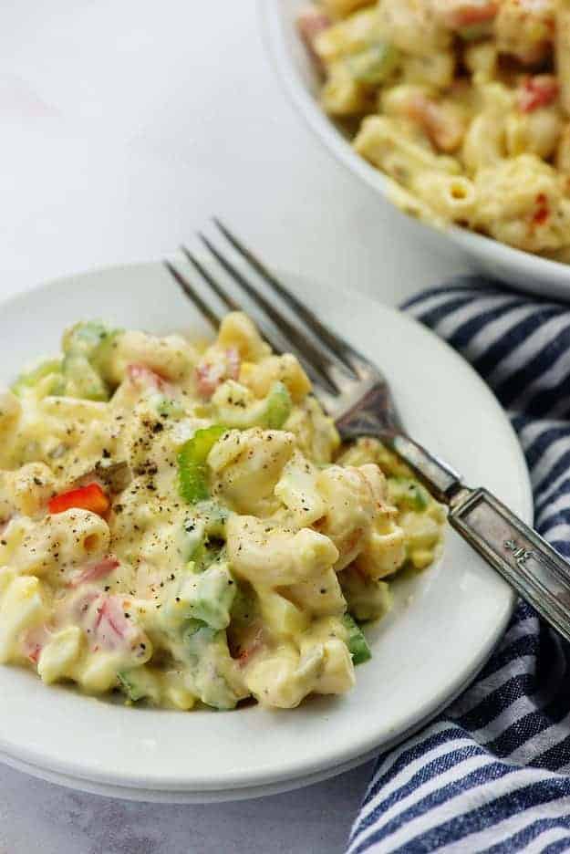 macaroni salad recipe on white plate with fork