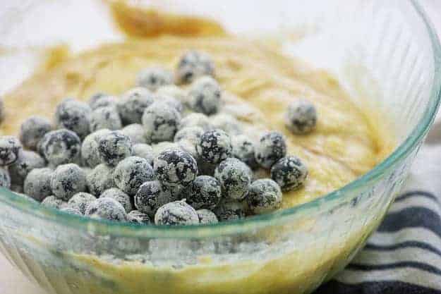 blueberries with flour in banana bread batter