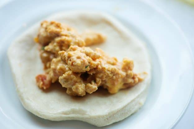 chicken filling in biscuit dough on white plate