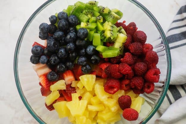 variety of fruit in glass mixing bowl