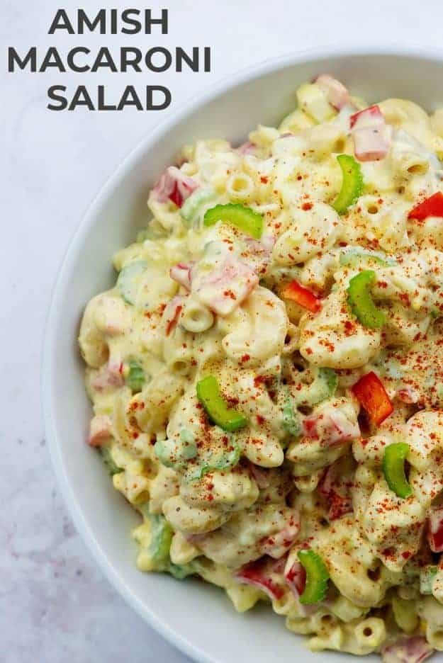 macaroni salad in white bowl with celery on top
