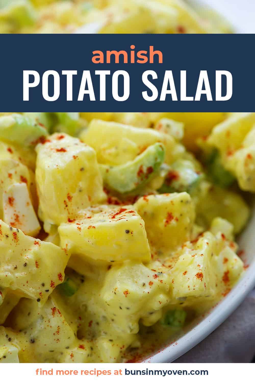 amish potato salad recipe with paprika on top in white bowl