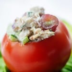chicken salad recipe stuffed inside a tomato