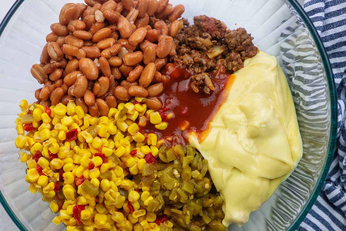 ingredients for mexican tater tot casserole in glass mixing  bowl