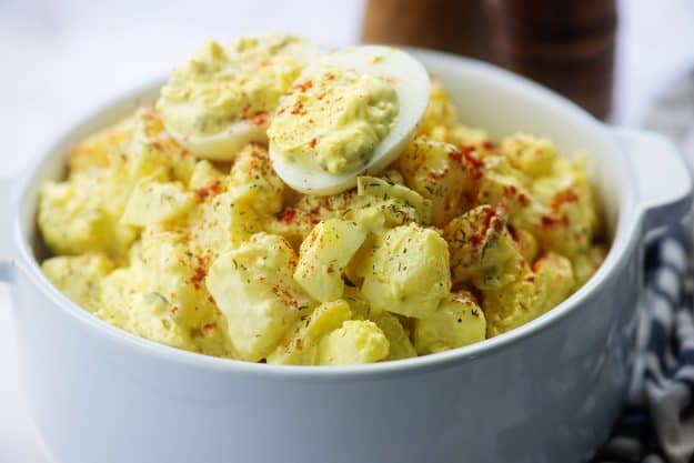 deviled egg potato salad in white bowl