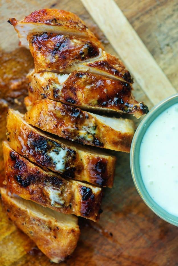 grilled chicken with white barbecue sauce on top