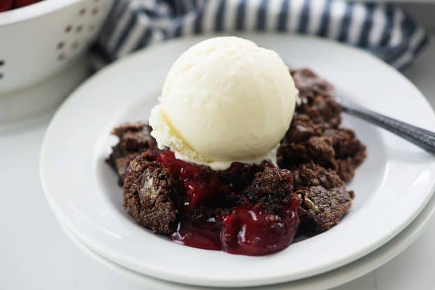 chocolate dump cake with vanilla ice cream on top