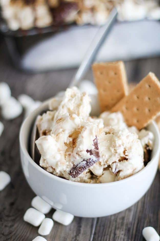 s'mores ice cream in small white bowl with graham crackers
