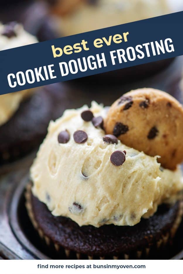 cookie dough frosting with chocolate chip cookie on cupcake in metal pan