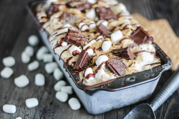 no churn ice cream in loaf pan with marshmallows, graham crackers, and chocolate on top