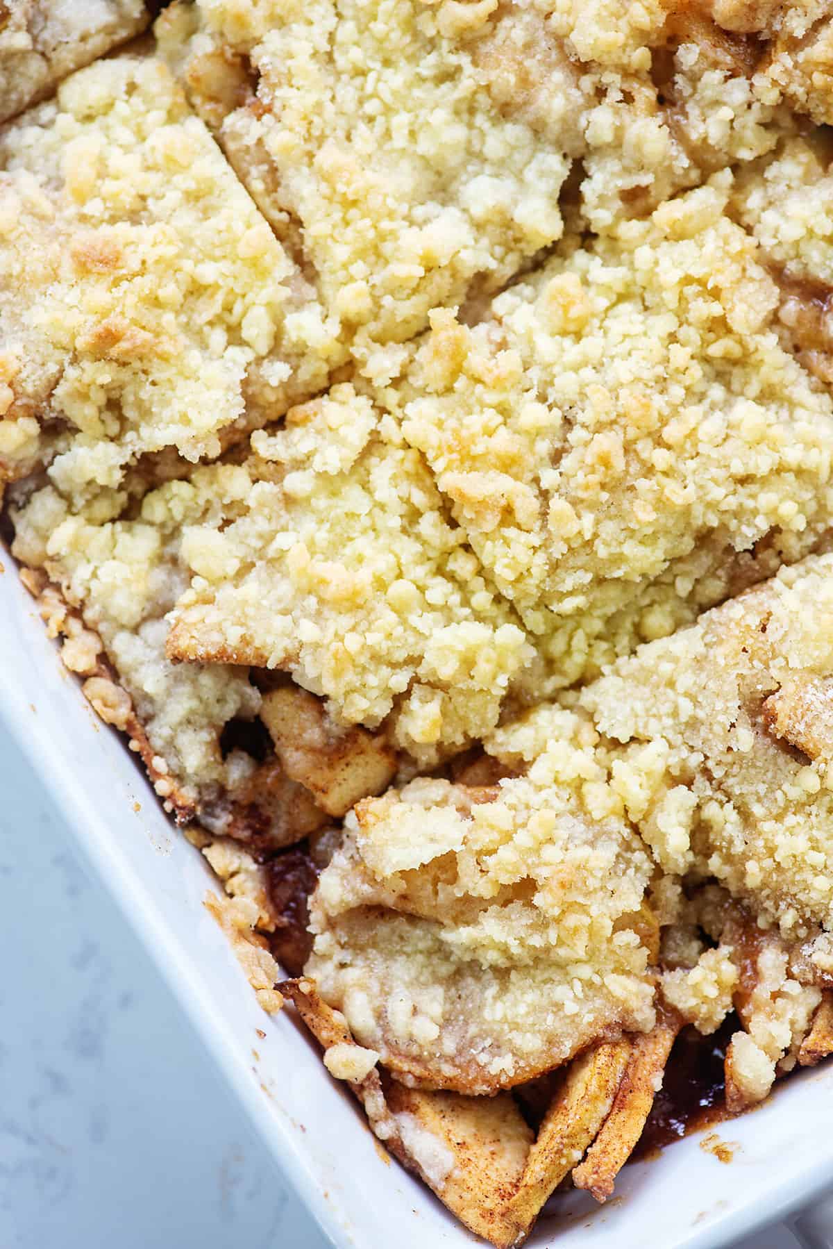 apple crumb bars in white dish