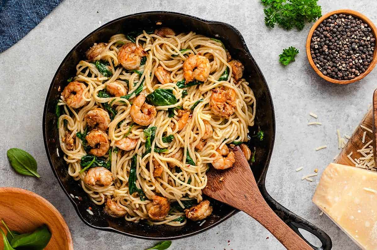 pasta with parmesan, garlic, and shrimp in cast iron skillet