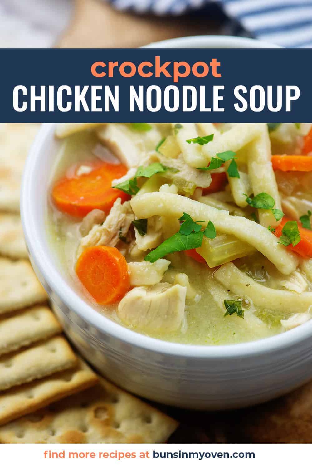 crockpot chicken noodle soup recipe in white bowl with crackers