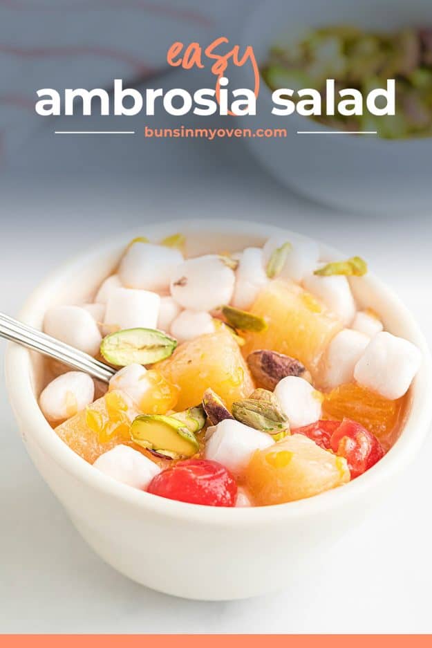 easy ambrosia salad in white bowl with pistachios on top