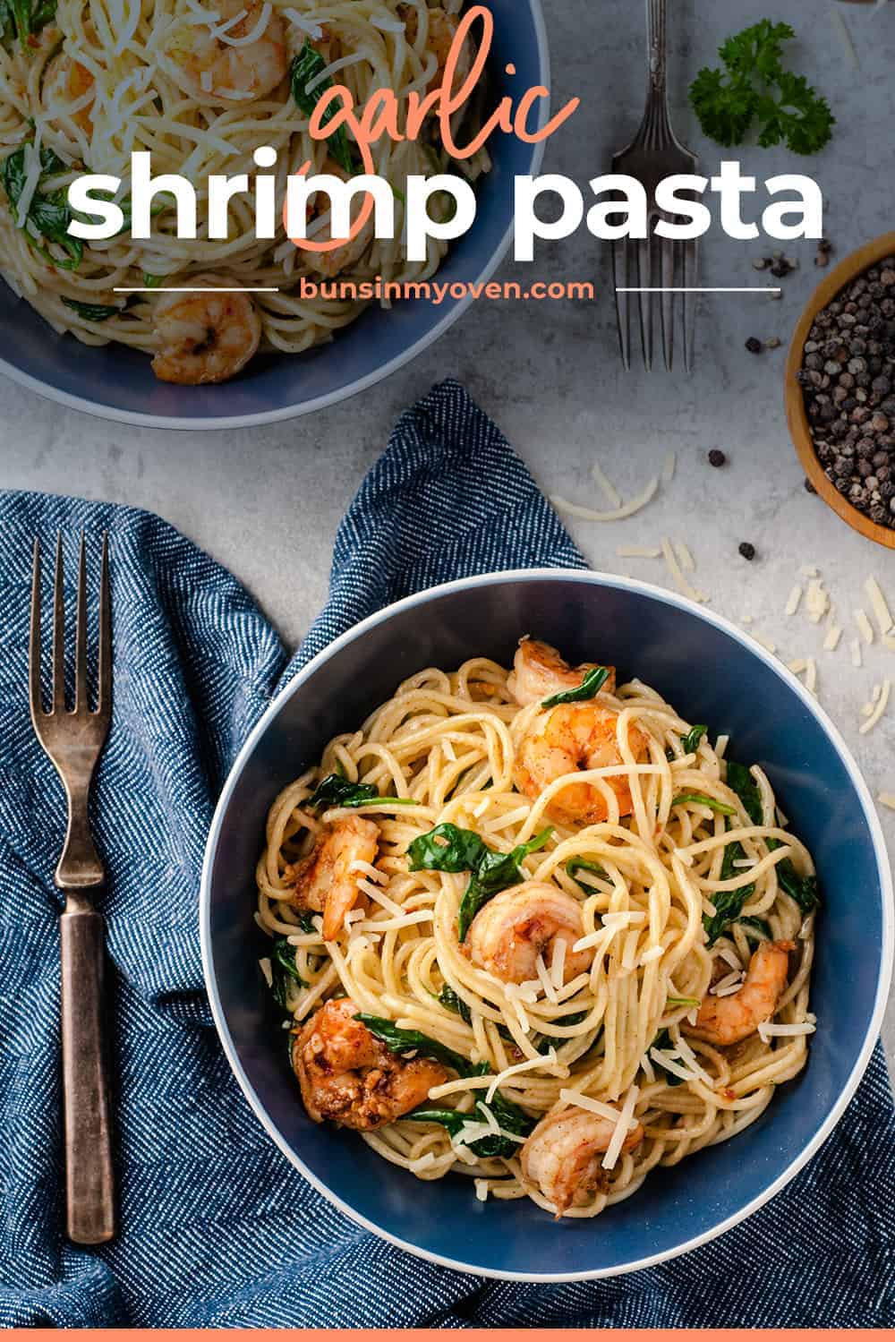 garlic shrimp pasta in blue bowl with napkin