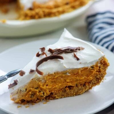 slice of pumpkin pie on white plate