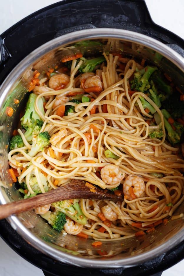 Instant Pot Shrimp Lo Mein with wooden spoon.