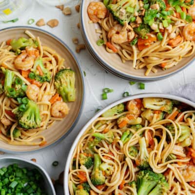 shrimp lo mein in bowls.